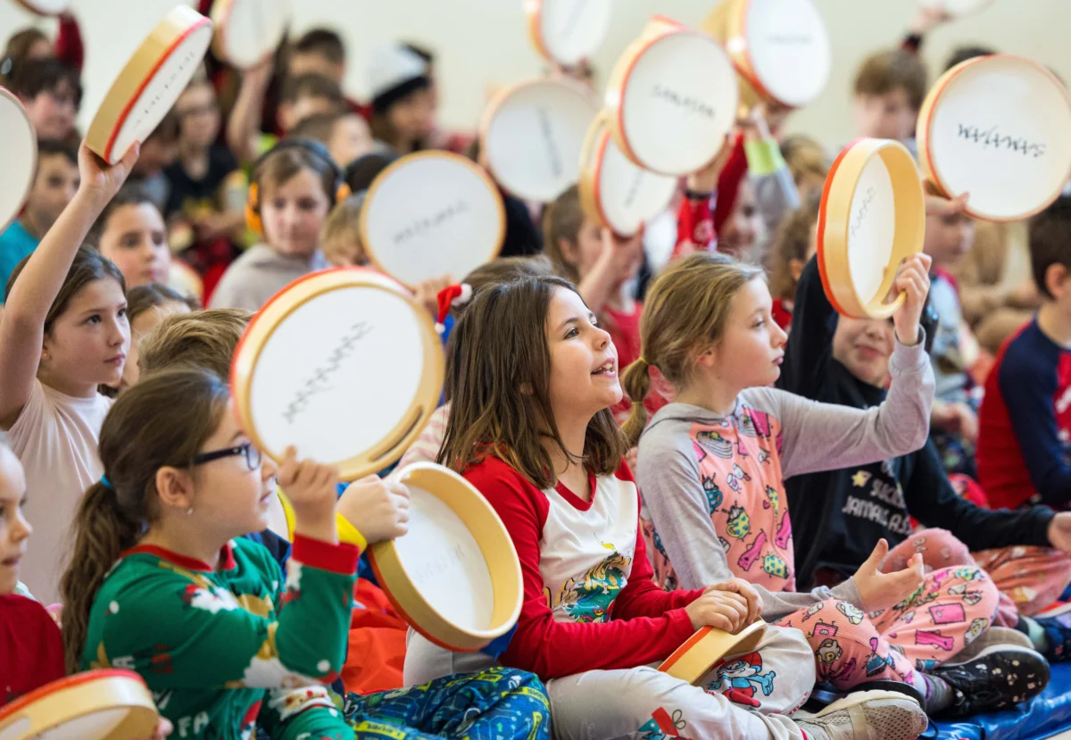 Students play SAMAJAM tambourines